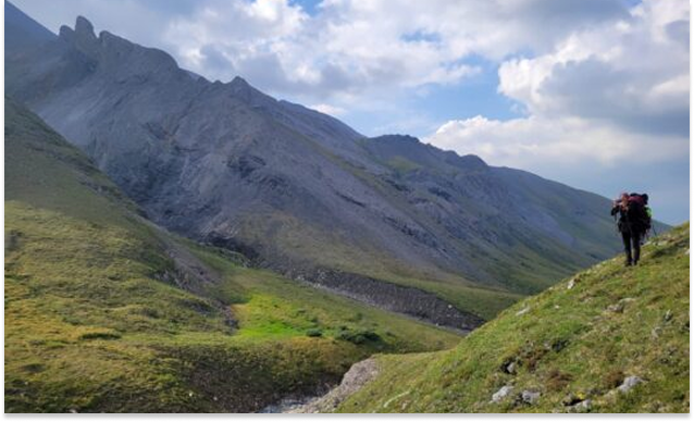 Mountain landscape with hiker